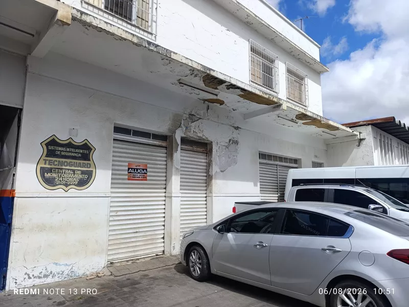 Ponto comercial com prateleiras fundo da Aikon Hyundai ao lado da Av. Integração, São Vicente, Vi - Foto Principal
