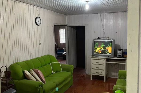 TERRENO BEM LOCALIZADO COM CASA MISTA 