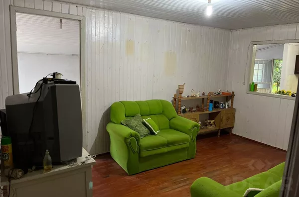 TERRENO BEM LOCALIZADO COM CASA MISTA 