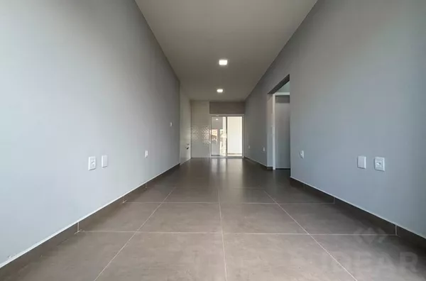 GEMINADO DE 2 DORMITÓRIOS, PÁTIO LATERAL E FRENTE - Foto 4