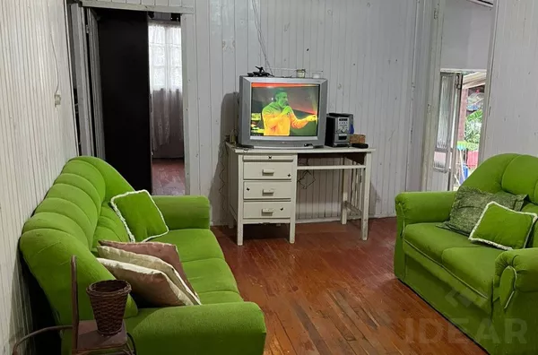 TERRENO BEM LOCALIZADO COM CASA MISTA 