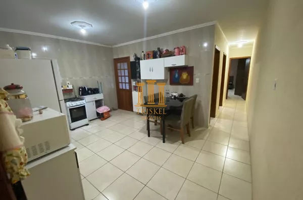 Casa 2 Dorm com garagem coberta e quintal 