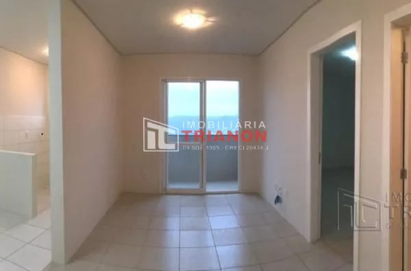 visão cozinha/lavanderia e sala de estar/jantar