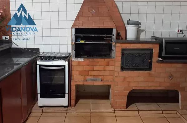 CASA COM VARANDA GOURMET