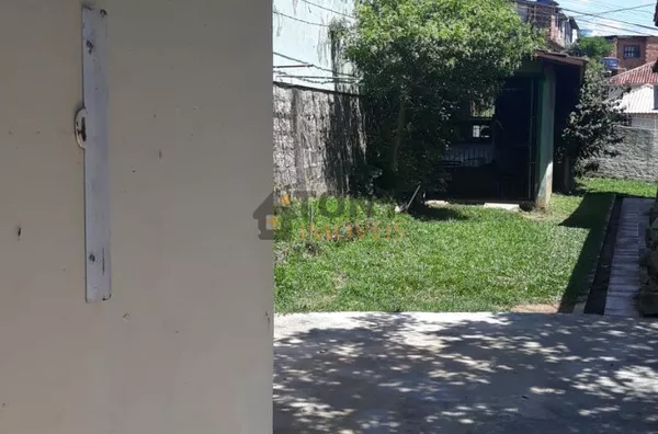 casa de madeira + terreno com 385 m² 