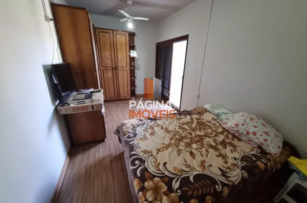 Dormitório com sacada