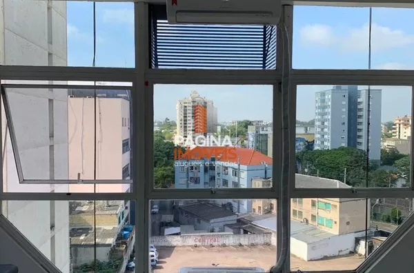 Página 1 Imóveis anuncia sala comercial com lavabo no condomínio "Empresarial Baronio", no bairro Centro em Canoas/RS.