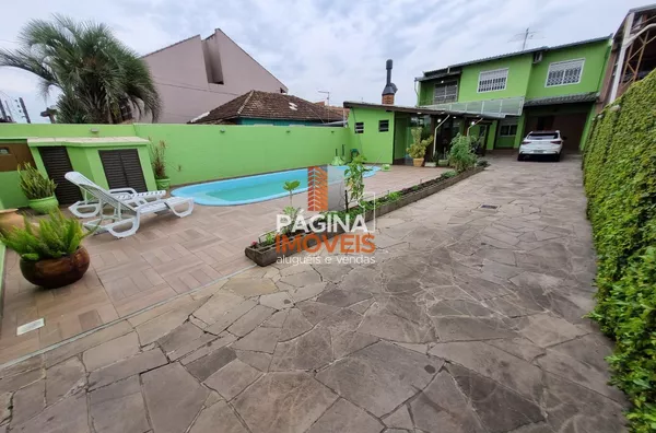 Página 1 Imóveis anuncia linda e aconchegante casa com piscina de 3 dormitórios no bairro São Luís em Canoas/RS. - Foto 2