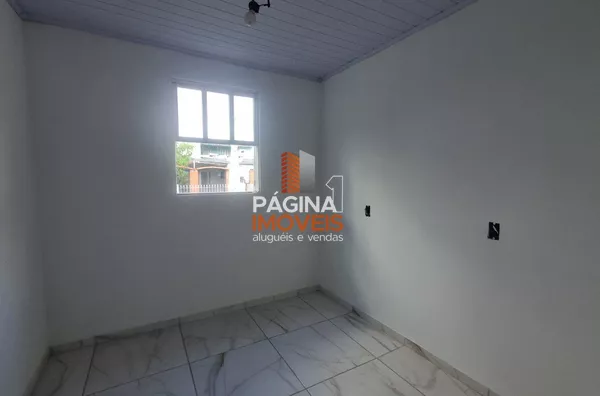 Pagina 1 Imóveis anuncia para aluguel, "casa com 2 dormitórios" no bairro Harmonia em Canoas/RS.