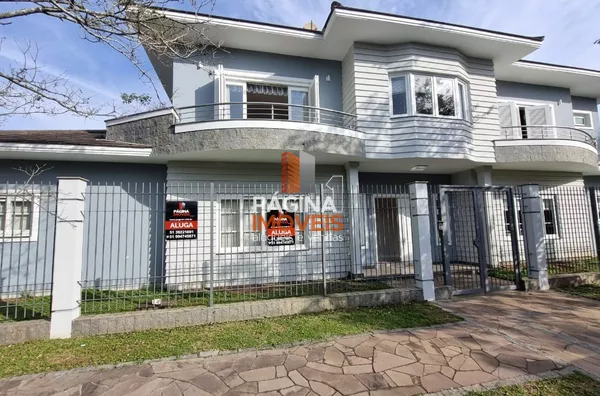 Excelente opção de casa para aluguel e venda com 03 dormitórios 01 suíte e vaga para 04 carros no bairro Moinhos de Vento em Canoas/RS - Foto 1