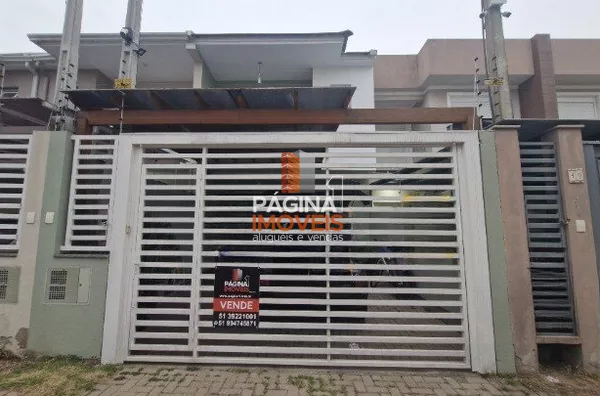 Página 1 Imóveis anuncia para venda, uma excelente casa/sobrado com 03 dormitórios, sendo 01 suíte, no bairro Igara em Canoas/RS.