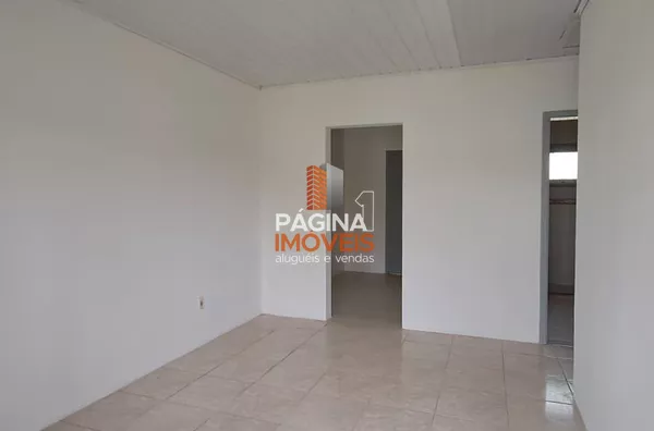 Página 1 Imóveis anuncia excelente casa térrea de 02 dormitórios para aluguel, no bairro Fátima, em Canoas/RS.