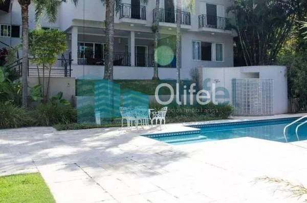 Casa residencial à venda, condomínio Estância Marambaia, Vinhedo. Maravilhosa casa, implantada em 4 lotes unificados que são passíveis de desmembramento, recentemente reformada, possui sala de estar com varanda e lago de carpas, sala de jantar, home theat - Foto 3