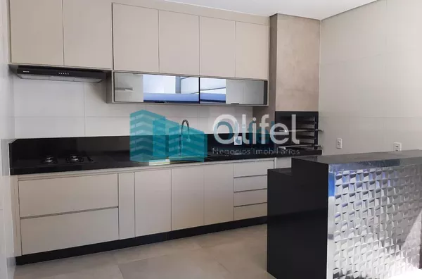 Linda casa térrea, 206m².O imóvel conta com 03 suítes com armários, sendo a suíte master com closet, escritório, lavabo, sala 2 ambientes, cozinha com armários e espaço gourmet com churrasqueira e armários, fogão cooktop  ja instalado. Piscina Aquecida. T - Foto 6