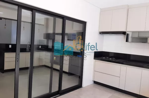 Linda casa térrea, 206m².O imóvel conta com 03 suítes com armários, sendo a suíte master com closet, escritório, lavabo, sala 2 ambientes, cozinha com armários e espaço gourmet com churrasqueira e armários, fogão cooktop  ja instalado. Piscina Aquecida. T - Foto 13