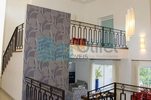 Casa residencial à venda, condomínio Estância Marambaia, Vinhedo. Maravilhosa casa, implantada em 4 lotes unificados que são passíveis de desmembramento, recentemente reformada, possui sala de estar com varanda e lago de carpas, sala de jantar, home theat - Foto 6
