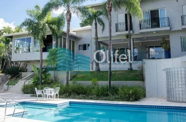 Casa residencial à venda, condomínio Estância Marambaia, Vinhedo. Maravilhosa casa, implantada em 4 lotes unificados que são passíveis de desmembramento, recentemente reformada, possui sala de estar com varanda e lago de carpas, sala de jantar, home theat - Foto 1
