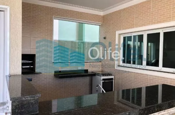 Sobrado em condomínio na cidade de Louveira,  com 3 dormitórios, 2 suítes, sendo 1 master com closet, escritório, sala 3 ambientes, home theater, ampla cozinha rica em armários, despensa, lavanderia, área gourmet com varanda, piscina aquecida, todo piso e - Foto 6