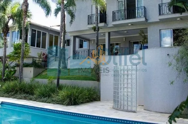 Casa residencial à venda, condomínio Estância Marambaia, Vinhedo. Maravilhosa casa, implantada em 4 lotes unificados que são passíveis de desmembramento, recentemente reformada, possui sala de estar com varanda e lago de carpas, sala de jantar, home theat - Foto 5