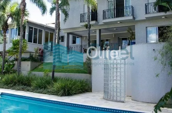 Casa residencial à venda, condomínio Estância Marambaia, Vinhedo. Maravilhosa casa, implantada em 4 lotes unificados que são passíveis de desmembramento, recentemente reformada, possui sala de estar com varanda e lago de carpas, sala de jantar, home theat - Foto 5
