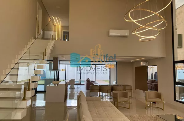 Linda casa no  condomínio  Santa Isabel na cidade de Louveira para quem procura espaço, modernismo, sofisticação, sossego e excelente iluminação. O imóvel dispõe de 525m² de terreno e 414m² de construção. O piso inferior oferece sala ampla  para 2 ambient - Foto 5