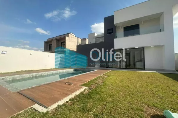 Linda casa no  condomínio  Santa Isabel na cidade de Louveira para quem procura espaço, modernismo, sofisticação, sossego e excelente iluminação. O imóvel dispõe de 525m² de terreno e 414m² de construção. O piso inferior oferece sala ampla  para 2 ambient - Foto 1