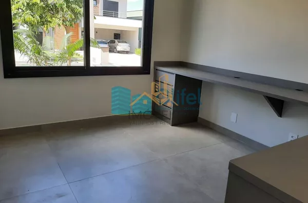 Linda casa térrea, 206m².O imóvel conta com 03 suítes com armários, sendo a suíte master com closet, escritório, lavabo, sala 2 ambientes, cozinha com armários e espaço gourmet com churrasqueira e armários, fogão cooktop  ja instalado. Piscina Aquecida. T - Foto 30