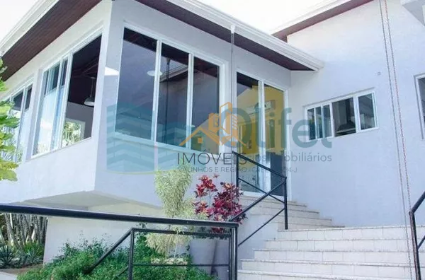 Casa residencial à venda, condomínio Estância Marambaia, Vinhedo. Maravilhosa casa, implantada em 4 lotes unificados que são passíveis de desmembramento, recentemente reformada, possui sala de estar com varanda e lago de carpas, sala de jantar, home theat - Foto 32